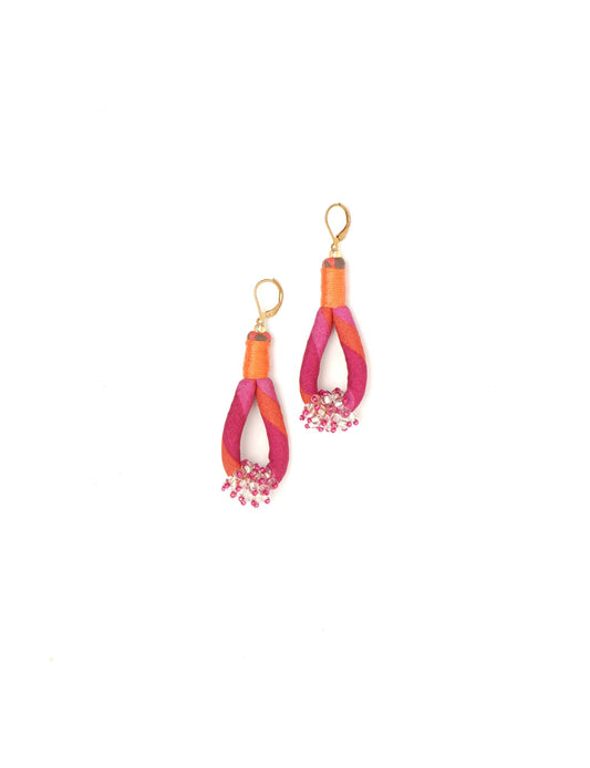 Discover the charm of Beaded Drop Earrings, meticulously crafted by Indian artisans. Recycled cotton rope, sari fabric, and surplus glass beads create an eco-friendly masterpiece. Hypoallergenic metal hooks ensure both style and comfort.