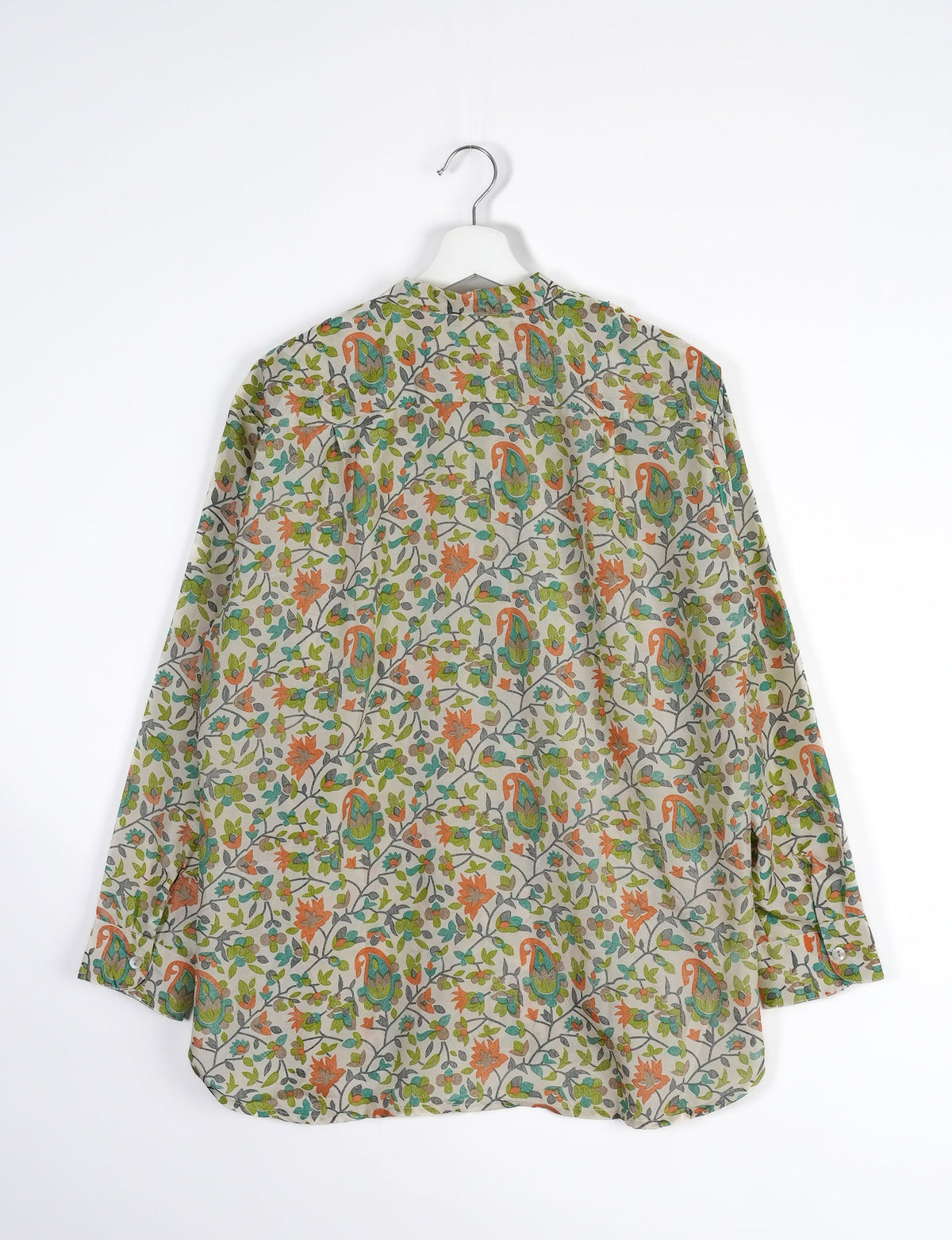 Sophisticated LONGLINE SHIRT with mandarin collar, bias yoke, and delicate bead embroidery edging. Crafted for sustainable fashion enthusiasts, this eco-friendly shirt offers versatile styling and timeless elegance for your conscious wardrobe.