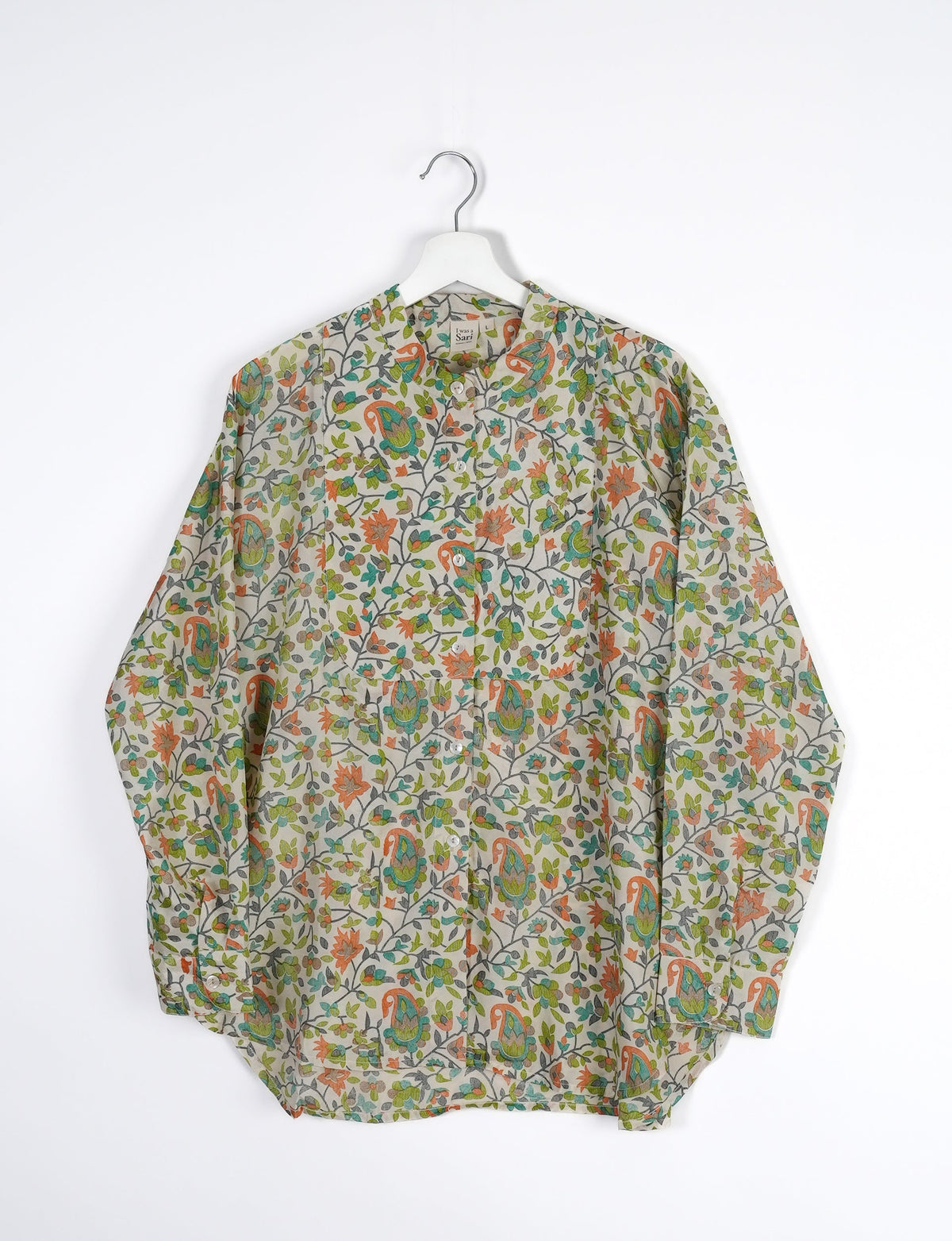 Sophisticated LONGLINE SHIRT with mandarin collar, bias yoke, and delicate bead embroidery edging. Crafted for sustainable fashion enthusiasts, this eco-friendly shirt offers versatile styling and timeless elegance for your conscious wardrobe.