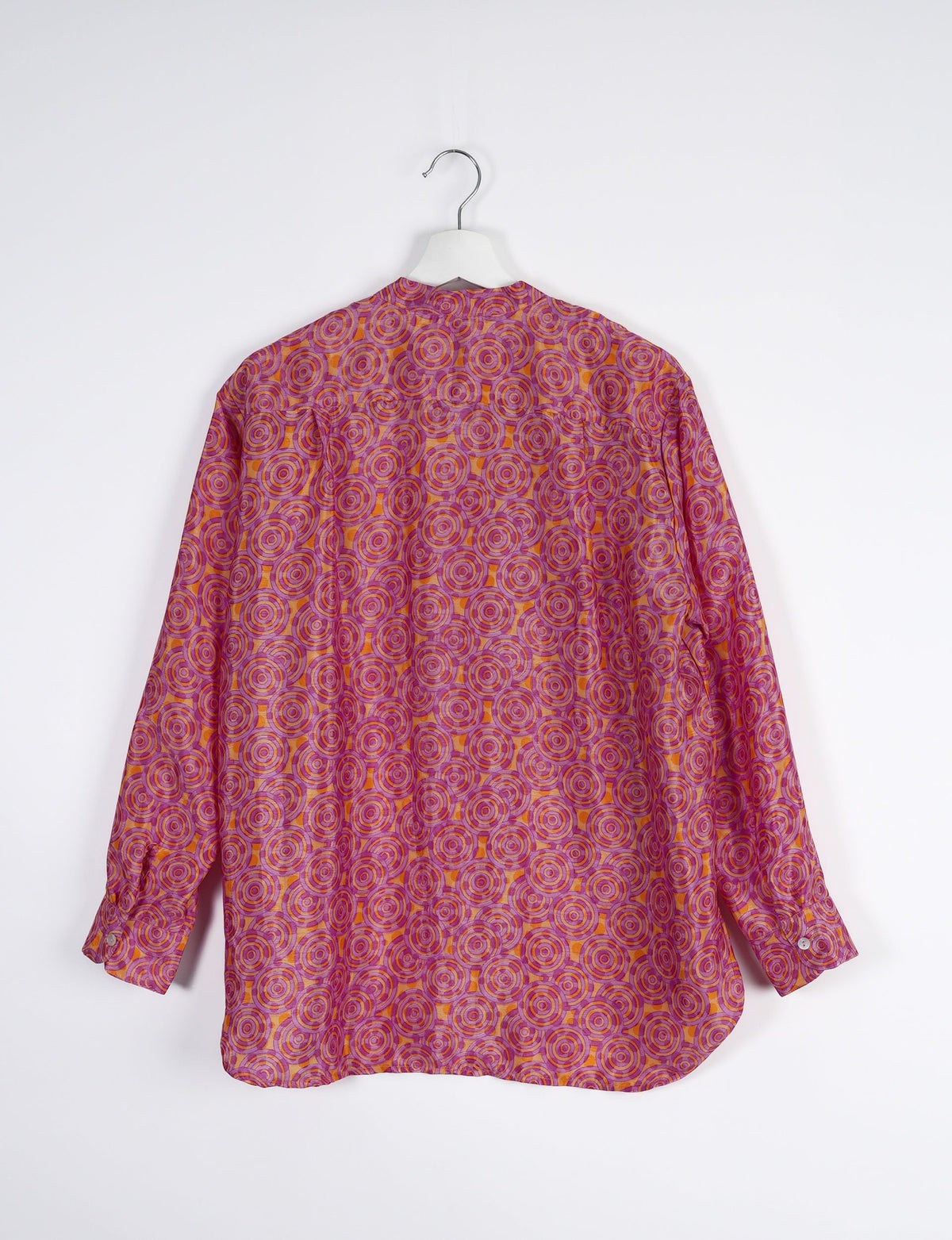 Sophisticated LONGLINE SHIRT with mandarin collar, bias yoke, and delicate bead embroidery edging. Crafted for sustainable fashion enthusiasts, this eco-friendly shirt offers versatile styling and timeless elegance for your conscious wardrobe.