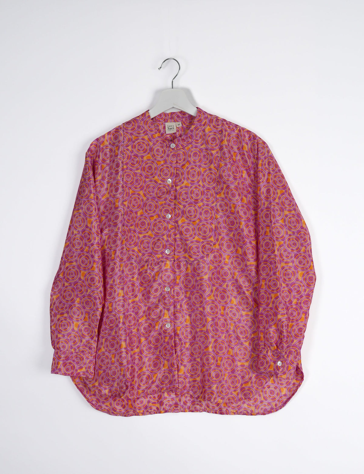 Sophisticated LONGLINE SHIRT with mandarin collar, bias yoke, and delicate bead embroidery edging. Crafted for sustainable fashion enthusiasts, this eco-friendly shirt offers versatile styling and timeless elegance for your conscious wardrobe.