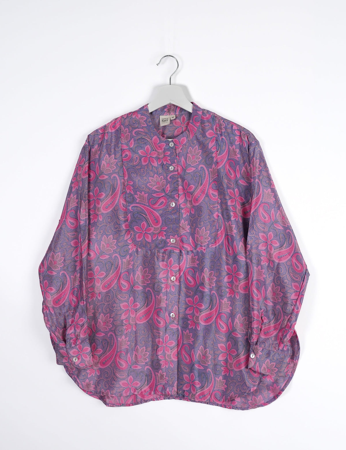 Sophisticated LONGLINE SHIRT with mandarin collar, bias yoke, and delicate bead embroidery edging. Crafted for sustainable fashion enthusiasts, this eco-friendly shirt offers versatile styling and timeless elegance for your conscious wardrobe.