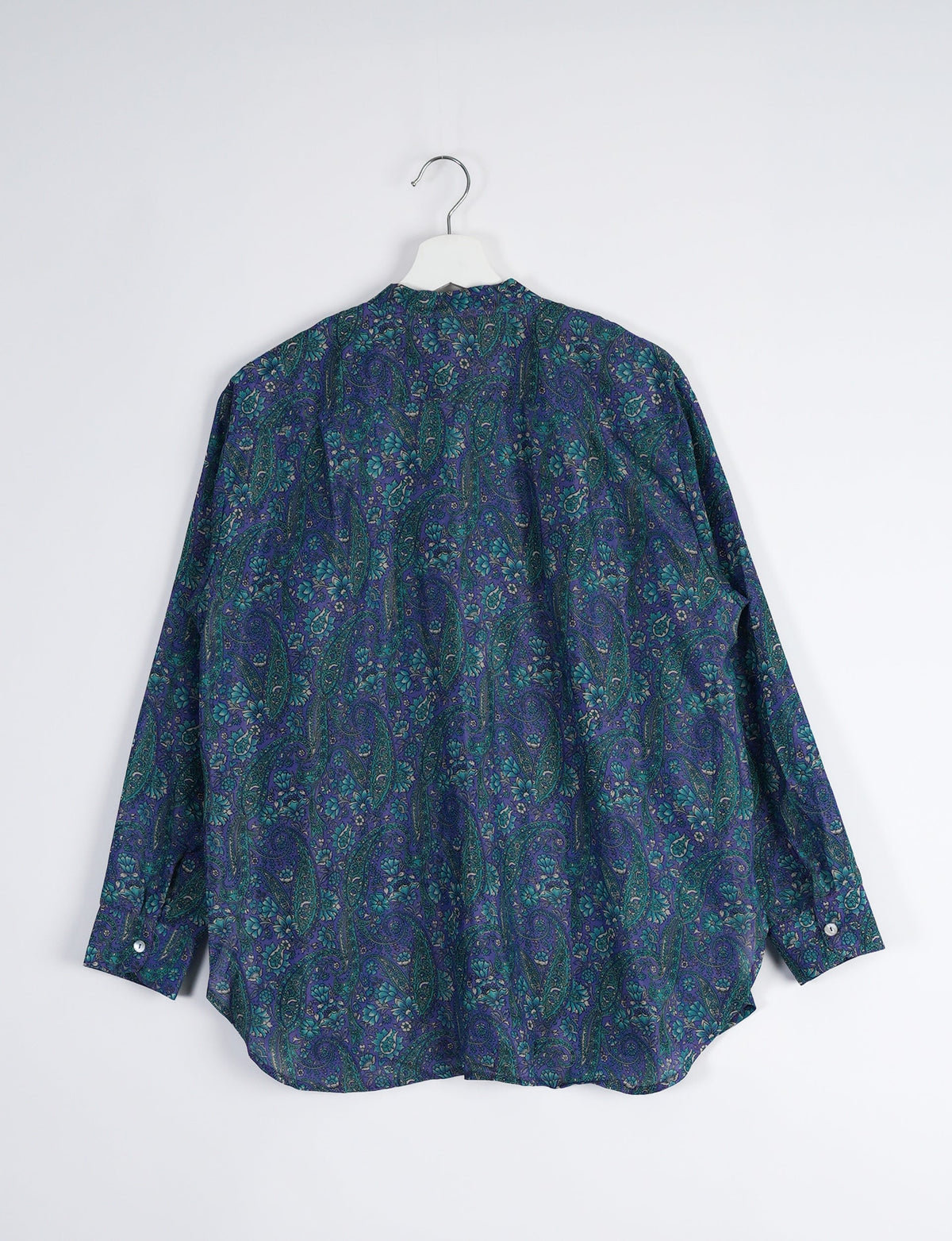 Sophisticated LONGLINE SHIRT with mandarin collar, bias yoke, and delicate bead embroidery edging. Crafted for sustainable fashion enthusiasts, this eco-friendly shirt offers versatile styling and timeless elegance for your conscious wardrobe.