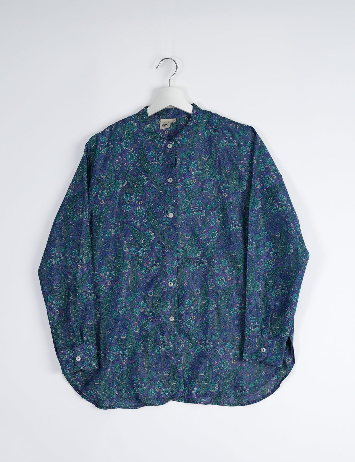 Sophisticated LONGLINE SHIRT with mandarin collar, bias yoke, and delicate bead embroidery edging. Crafted for sustainable fashion enthusiasts, this eco-friendly shirt offers versatile styling and timeless elegance for your conscious wardrobe.