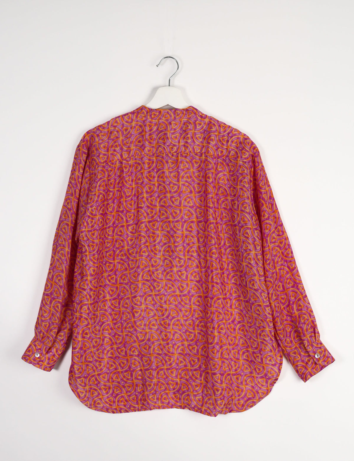 Sophisticated LONGLINE SHIRT with mandarin collar, bias yoke, and delicate bead embroidery edging. Crafted for sustainable fashion enthusiasts, this eco-friendly shirt offers versatile styling and timeless elegance for your conscious wardrobe.