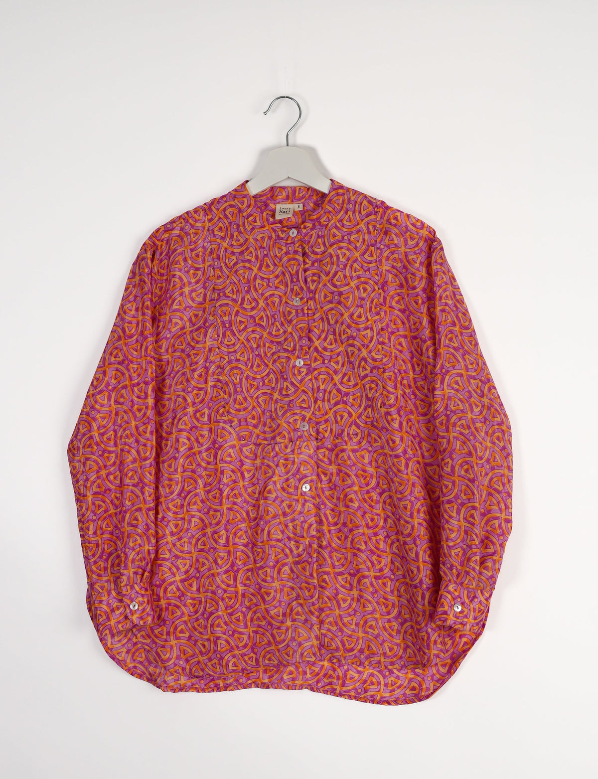 Sophisticated LONGLINE SHIRT with mandarin collar, bias yoke, and delicate bead embroidery edging. Crafted for sustainable fashion enthusiasts, this eco-friendly shirt offers versatile styling and timeless elegance for your conscious wardrobe.