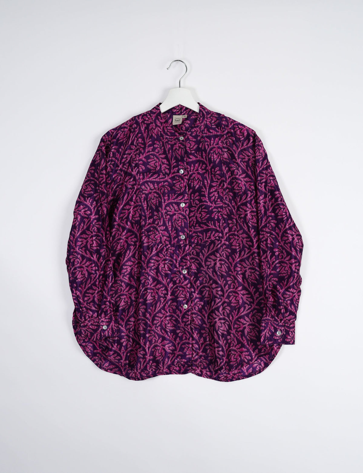 Sophisticated LONGLINE SHIRT with mandarin collar, bias yoke, and delicate bead embroidery edging. Crafted for sustainable fashion enthusiasts, this eco-friendly shirt offers versatile styling and timeless elegance for your conscious wardrobe.