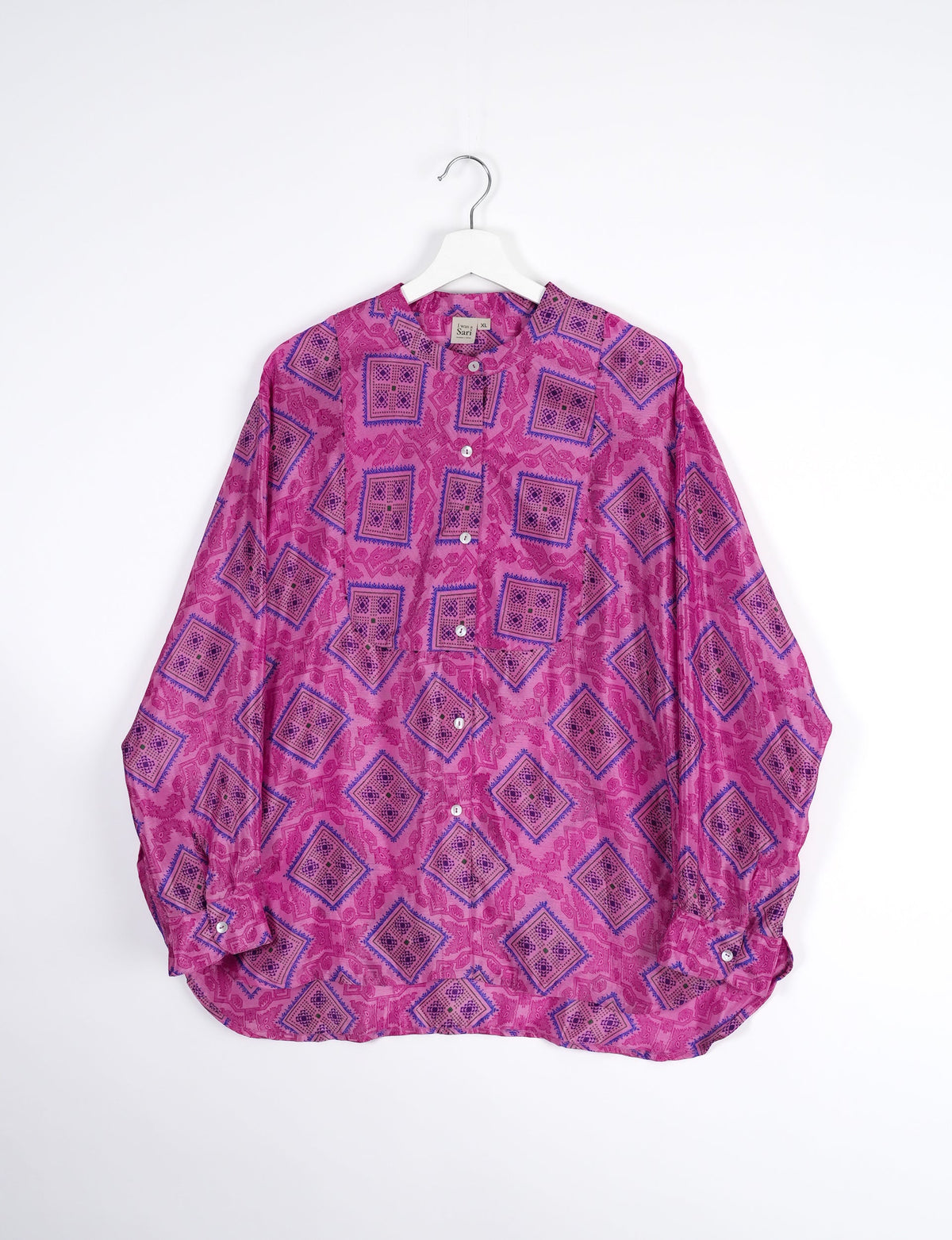 Sophisticated LONGLINE SHIRT with mandarin collar, bias yoke, and delicate bead embroidery edging. Crafted for sustainable fashion enthusiasts, this eco-friendly shirt offers versatile styling and timeless elegance for your conscious wardrobe.