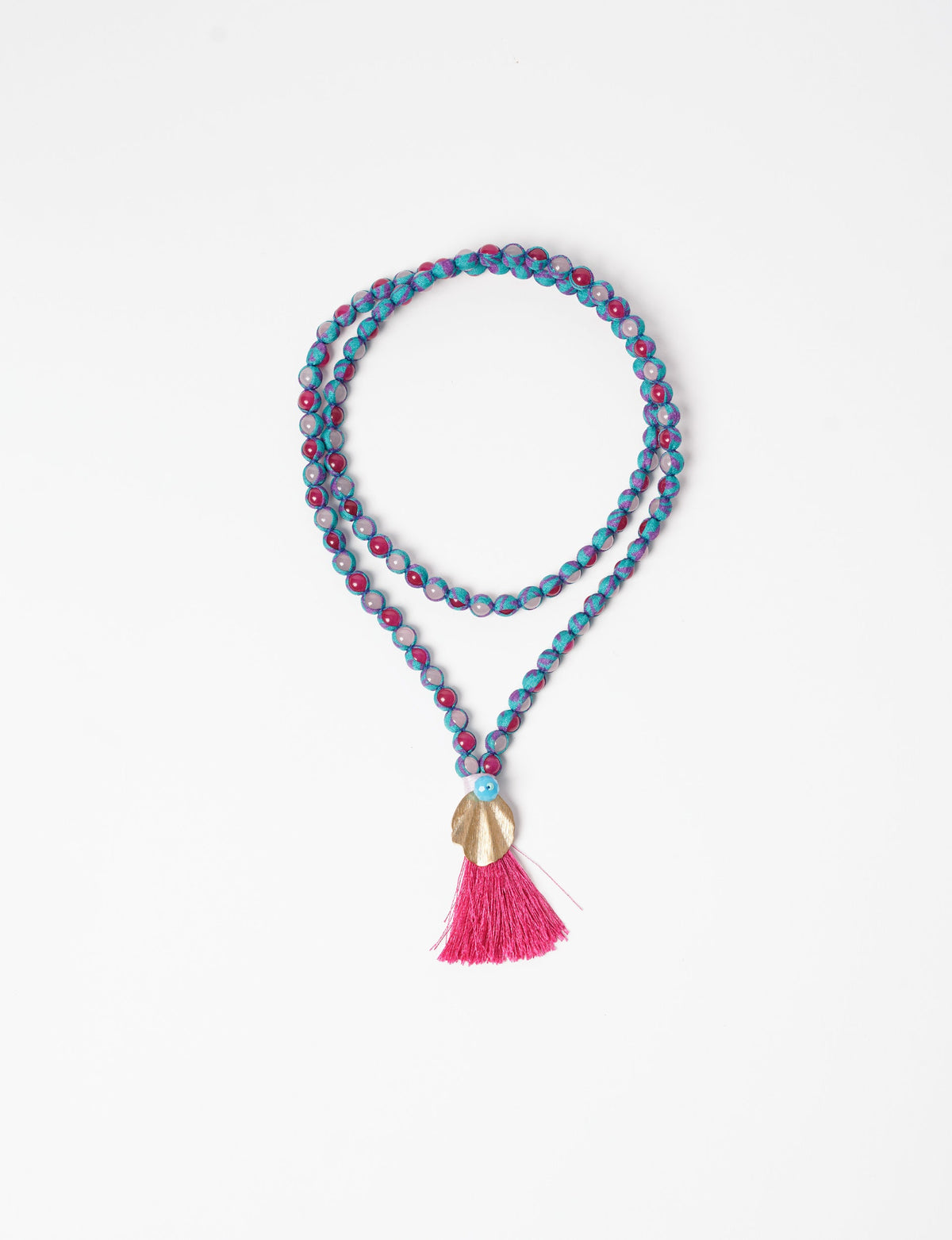 Discover elegance in our Beaded Tassel Necklace, meticulously handcrafted with glass beads, a silk tassel, and a metallic pendant. Hypoallergenic metal hooks provide a skin-friendly and stylish accessory. Length: 57 cm / 22.5 inches.