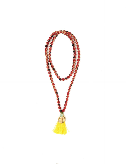 Discover elegance in our Beaded Tassel Necklace, meticulously handcrafted with glass beads, a silk tassel, and a metallic pendant. Hypoallergenic metal hooks provide a skin-friendly and stylish accessory. Length: 57 cm / 22.5 inches.