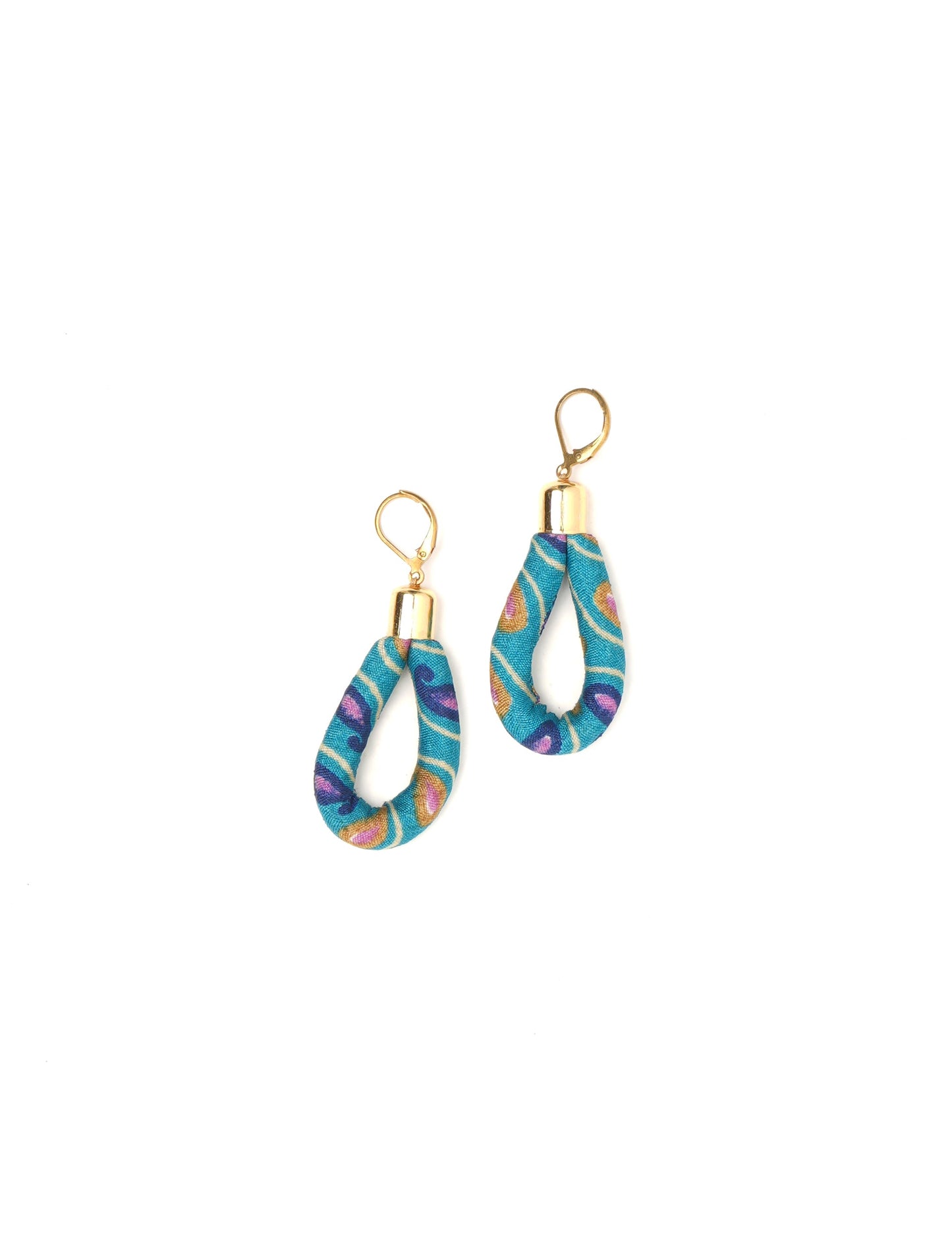 Elevate your style sustainably with our Rope Earrings. Crafted from cotton rope hand-wrapped with pre-loved saris, these earrings are a testament to ethical and green fashion. Make a conscious choice for a brighter, eco-friendly future.