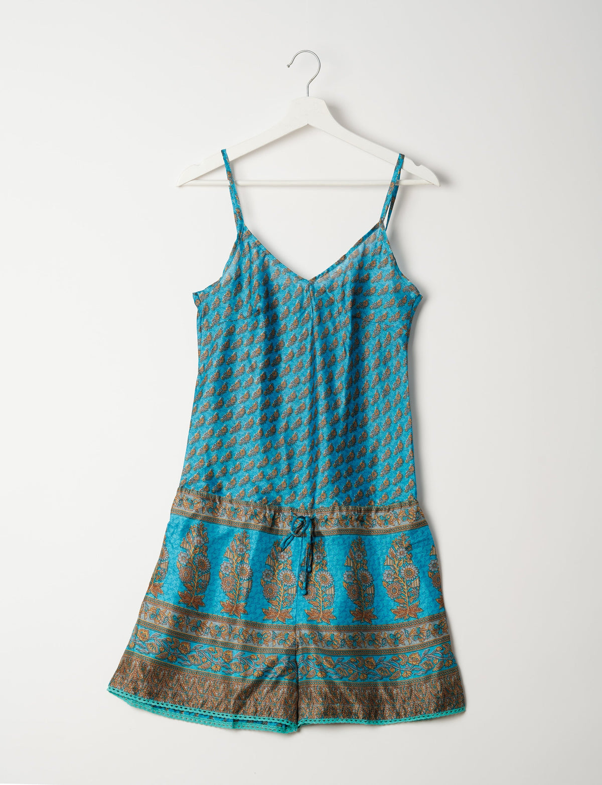 Vibrant playsuit with lace accents, crafted from upcycled saris. Embrace ethical fashion with this unique piece designed for conscious consumers.