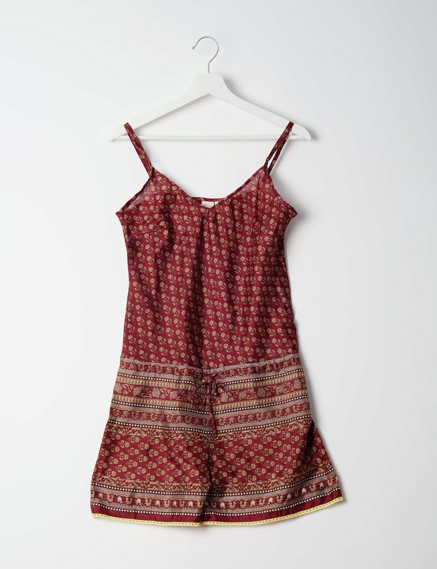 Vibrant playsuit with lace accents, crafted from upcycled saris. Embrace ethical fashion with this unique piece designed for conscious consumers.