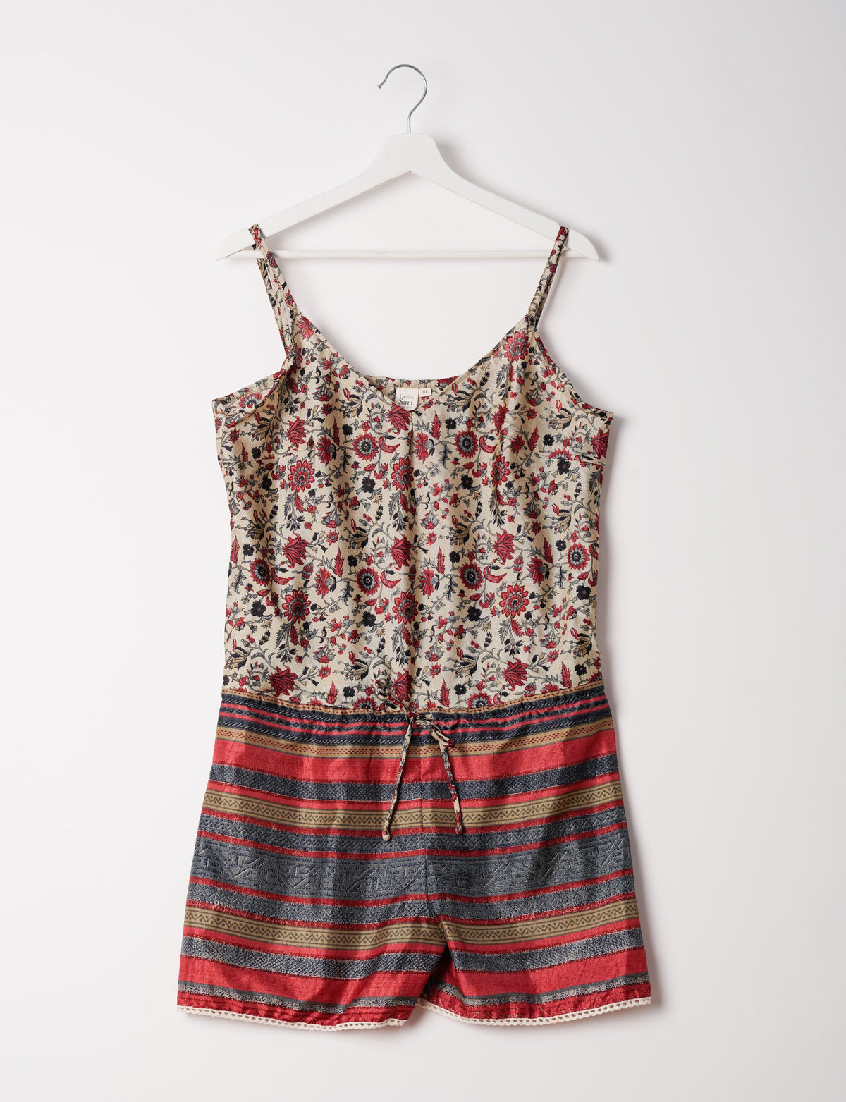 Vibrant playsuit with lace accents, crafted from upcycled saris. Embrace ethical fashion with this unique piece designed for conscious consumers.