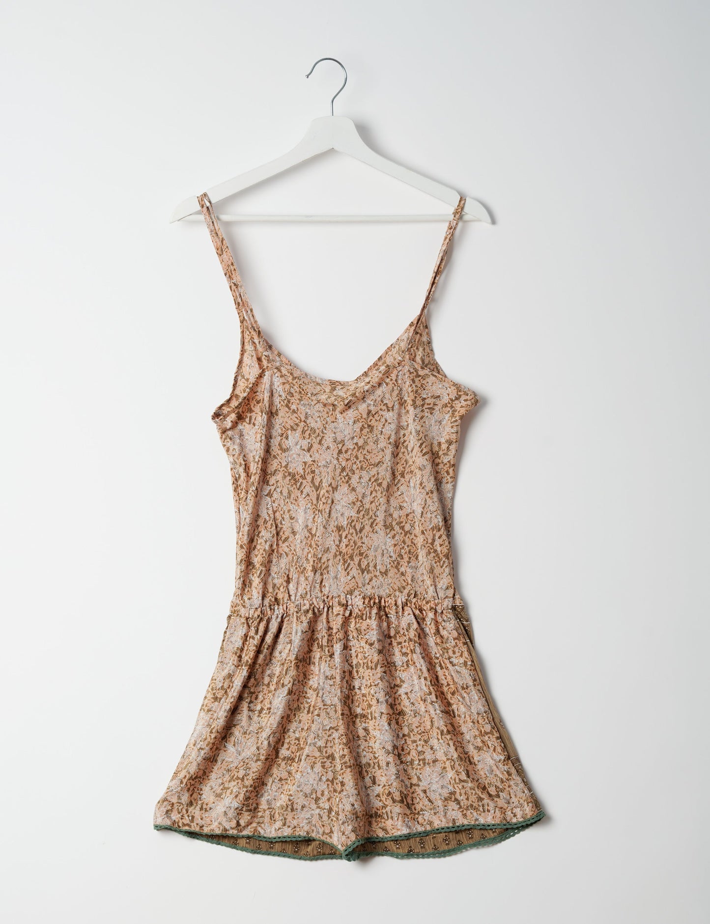 Vibrant playsuit with lace accents, crafted from upcycled saris. Embrace ethical fashion with this unique piece designed for conscious consumers.