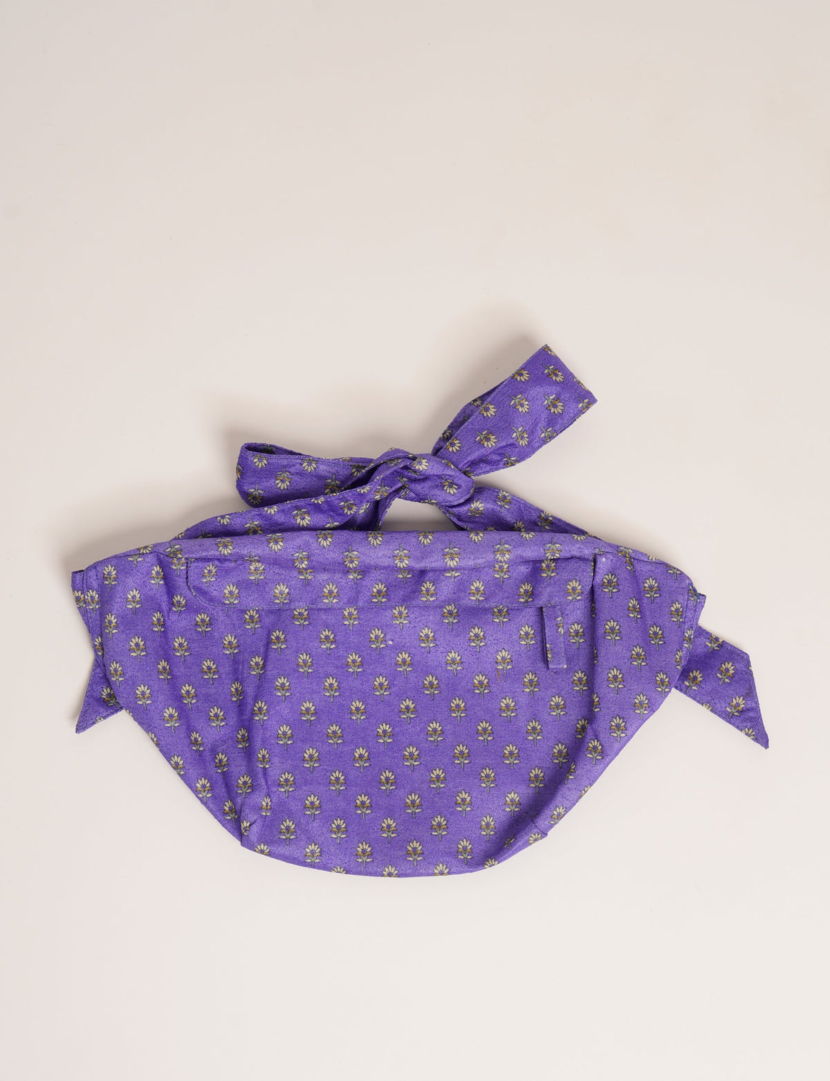 Elevate your eco-conscious travel style with our MIDI BELT BAG – the perfect companion for passports or day makeup. Crafted from eco-friendly and upcycled materials, this chic bag ensures sustainable and stylish travel. With a spacious interior, soft body, and free handles for easy knotting, it's ideal for conscious consumers valuing ethical fashion and green choices.