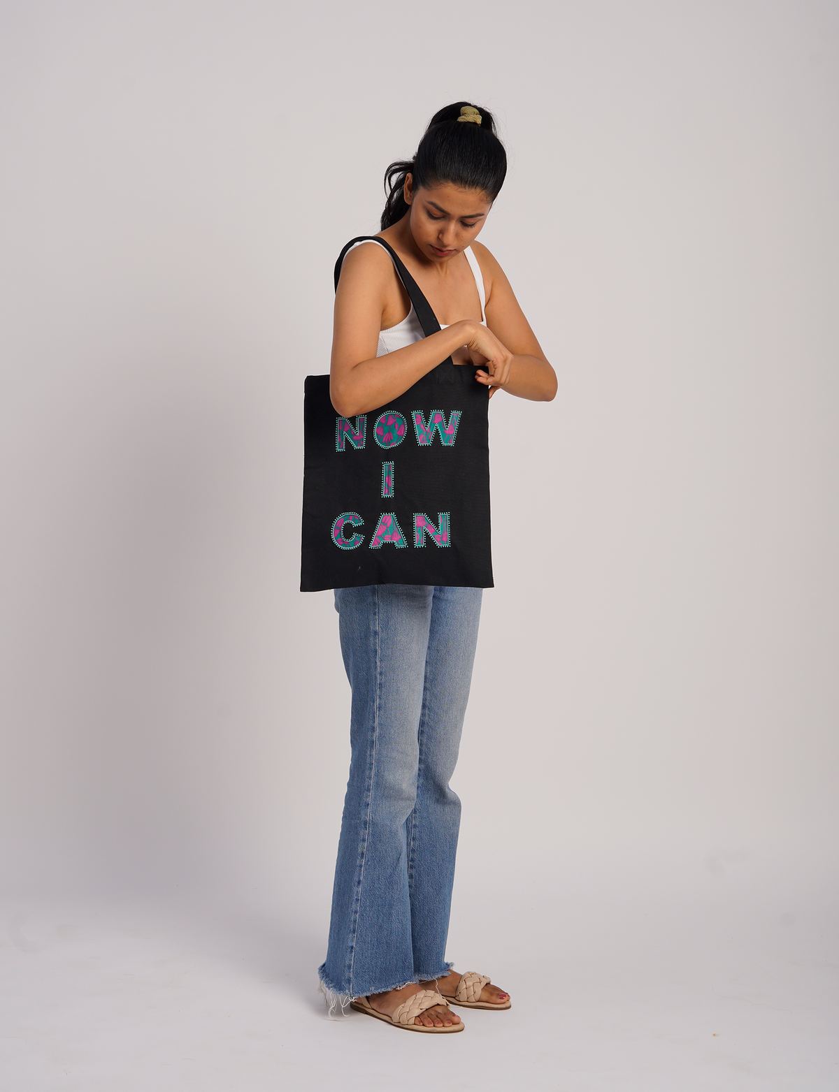 Discover empowerment with our NOW I CAN TOTE BAG – a distinctive piece from our embroidery collection, commemorating positive transformations in the lives of our women artisans. Each bag signifies empowerment, from community pride to supporting education dreams. Carefully crafted with embroidered signatures, these bags are not only visually appealing but also embody the artisans' journeys and the reincarnation of pre-loved saris into a new form – as your treasured bag.
